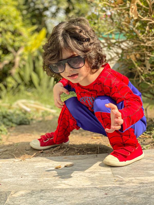 A Boy in Red and Black Spider Man Costume · Free Stock Photo